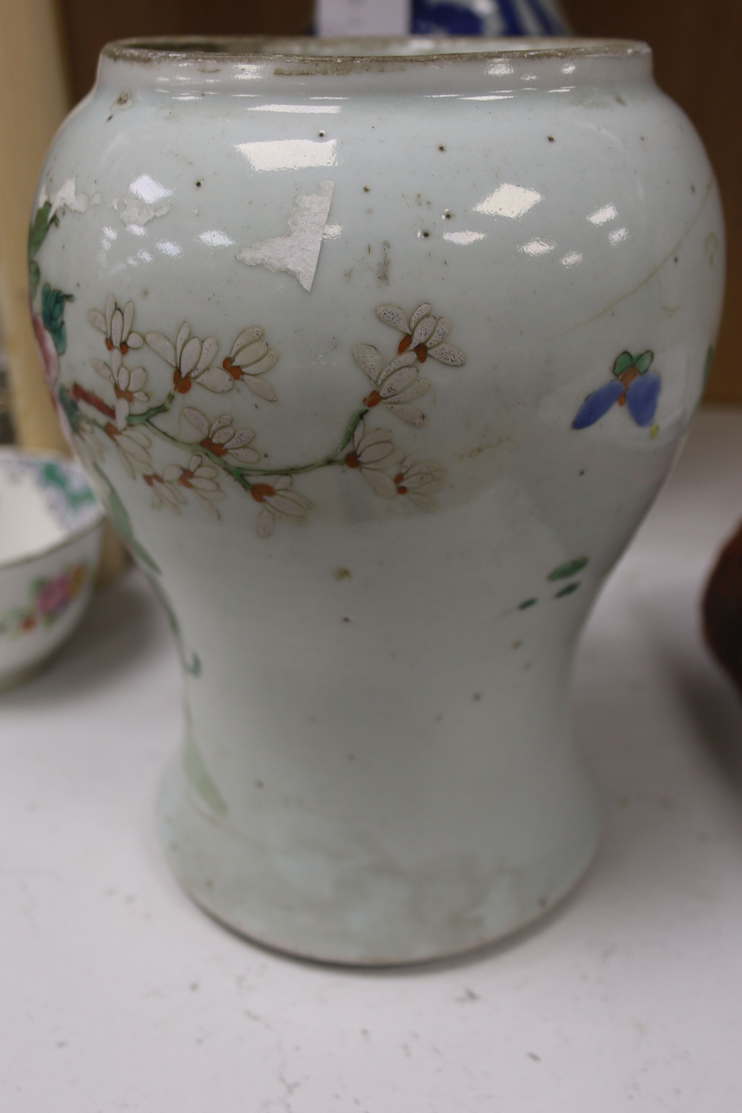 A Chinese blue and white 'Immortals' vase, 18th/19th century, damage, 34.5cm and a Chinese Yongzheng period famille rose ‘phoenix’ vase (reduced in height), 24cm